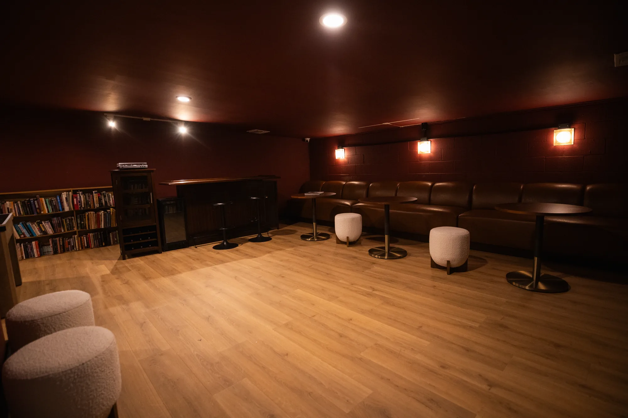 The members lounge at The Recording Club, with a bookshelf and bar